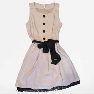 Pink Owl Dress. Cream color with black tie belt, size small.